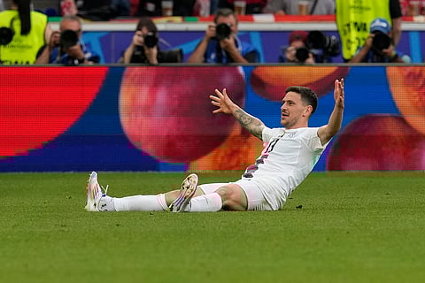 Slovenia's Erik Janza celebrates scoring a goal